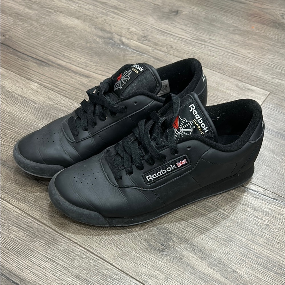 Reebok Black Athletic Shoes with Leather Upper and Monochromatic Design